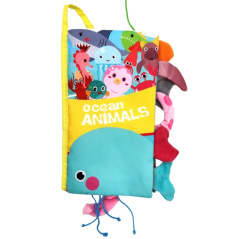 Książeczka sensoryczna z ogonkami Morskie zwierzątka / Woopie